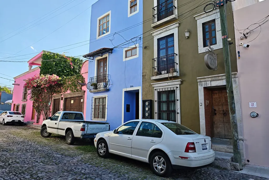 Vibrant painted homes on cobblestone street in Guadalupe San Miguel de Allende